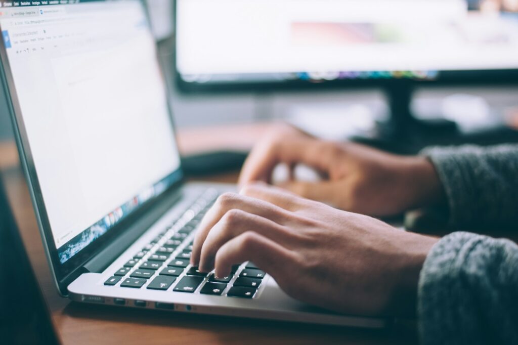 Developer building a fast, conversion-focused website on a laptop